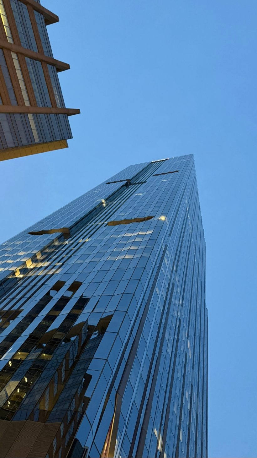 Glass tower against blue sky