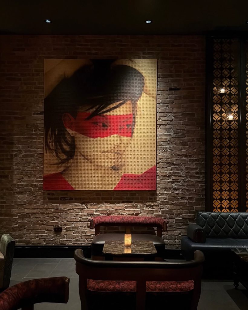 Restaurant interior with portrait artwork