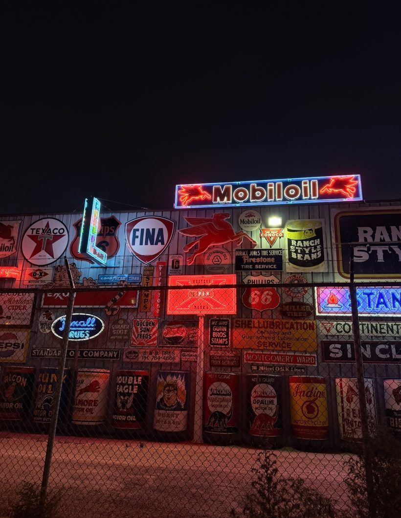 Vintage neon Mobiloil sign wall at night